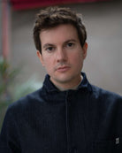 Model  wearing a dark denim paradaiza  jacket 