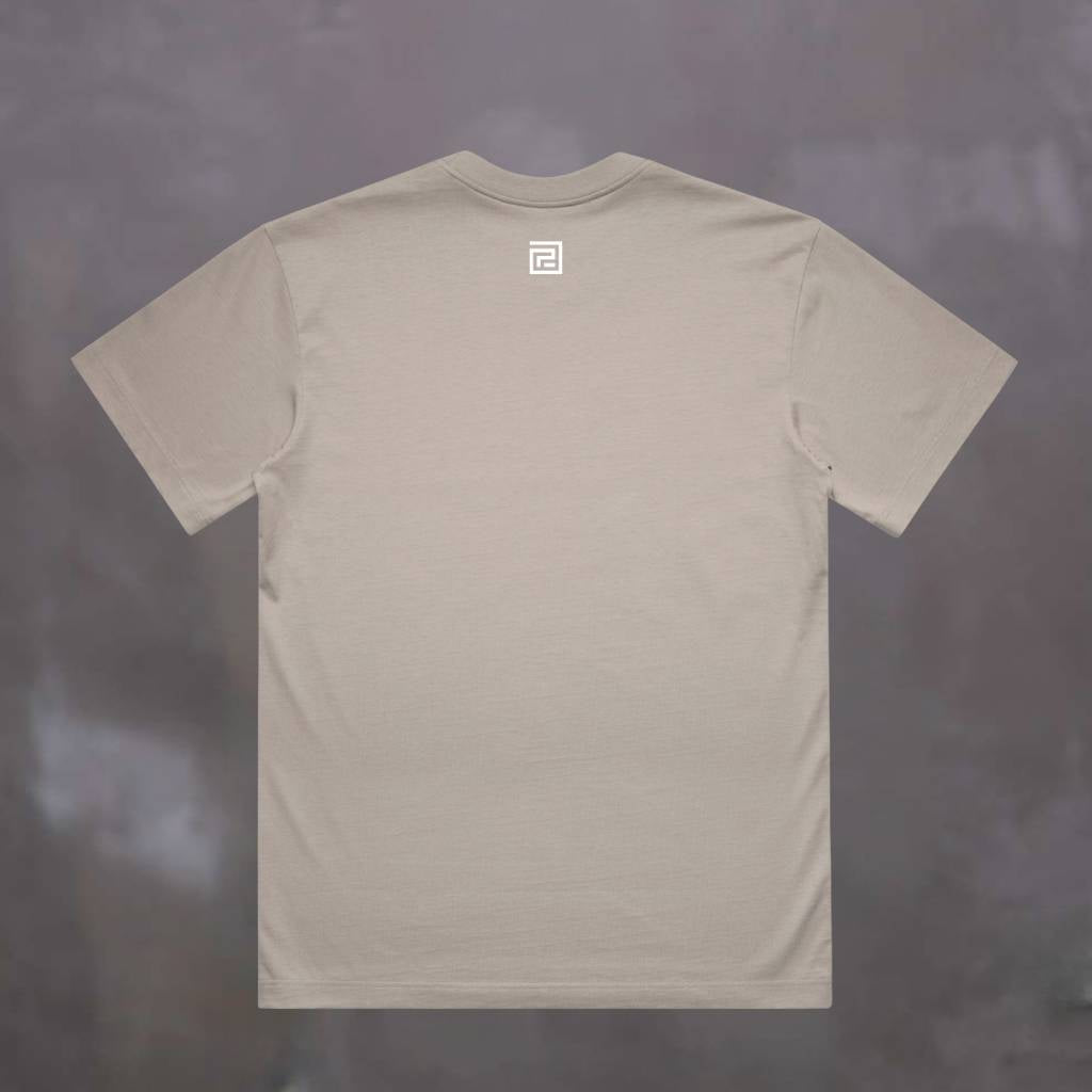 Beige paradaiza  t-shirt with a logo on the back against a dark background