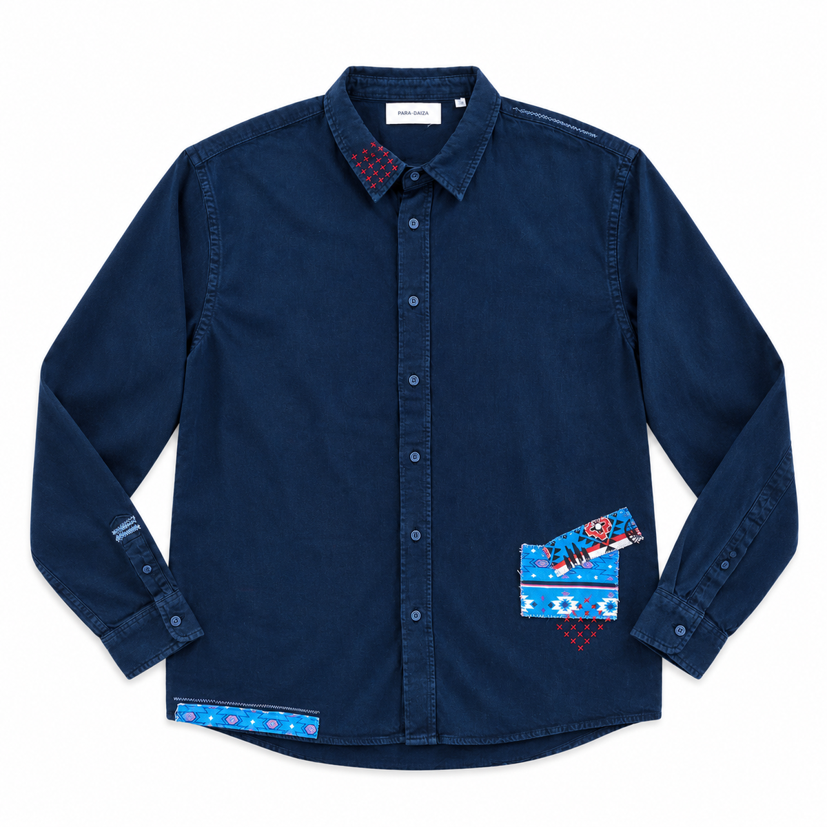 A dark navy blue long-sleeve button-up shirt with colorful geometric patterned accents on the collar, cuffs, hem, and chest pocket, displayed flat against a white background.