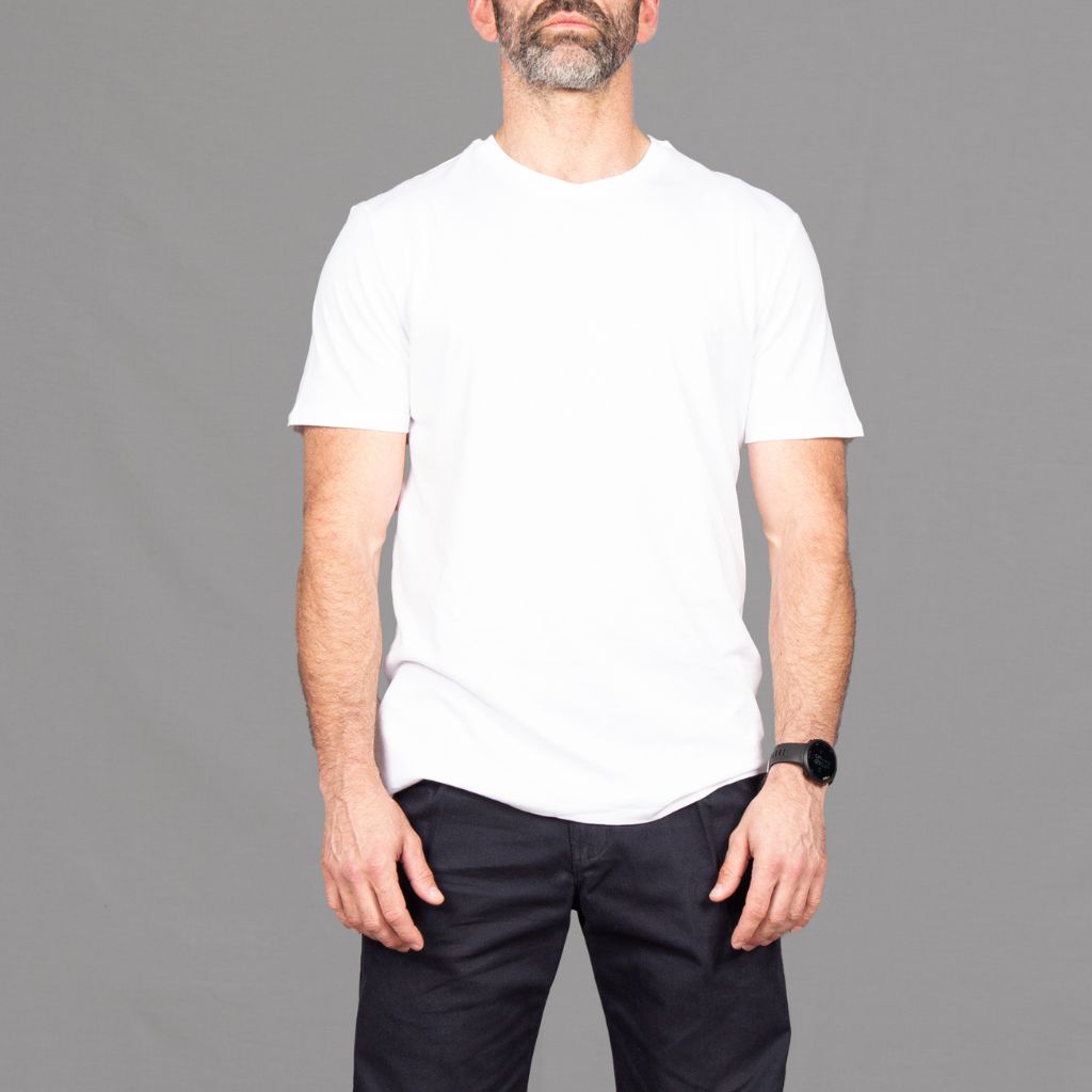 model wears core white t-shirt and navy chinos