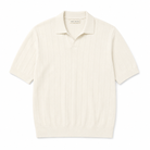 An off-white paradaiza ribbed knit polo shirt with short sleeves, a collar, and a buttonless placket, shown flat on a white background. The brand name 'PARK MAXIS' is visible on the inner neck label.