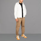 Wearing the pinched chinos and class top covered by the Commuter Jacket | Off White - Paradaiza