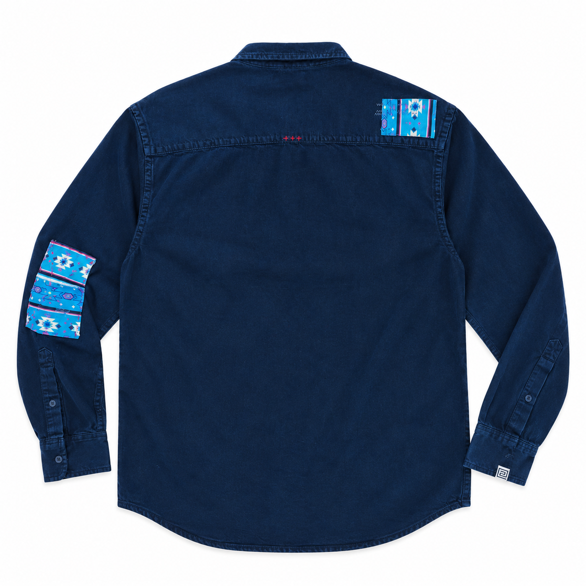 A dark navy blue long-sleeve button-up shirt shown from the back, featuring decorative blue and white patterned fabric patches on both shoulders and upper sleeves.