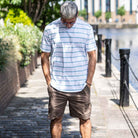 MODEL WEARS PARA-DAIZA STRIPED T-SHIRT AND CARGO SHORTS 