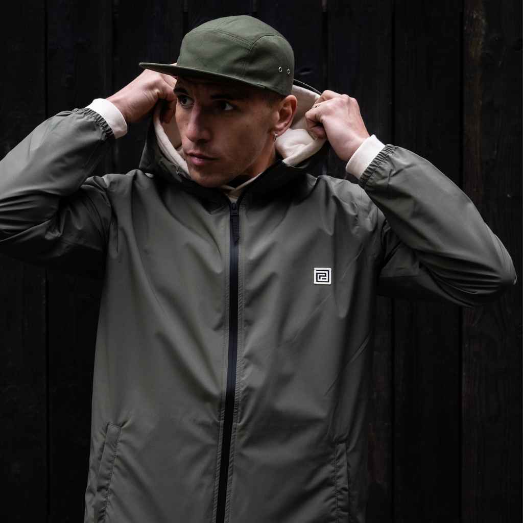 Model wears Para-Daiza Light weight Olive Parka Jacket and Cap