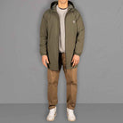 Model wears Para-Daiza Light weight Olive Parka Jacket and Tan Pinch Chinos, with Veja Sneakers