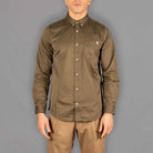 Model wears Para-Daiza button down  khaki shirt