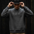 Model wears Para-Daiza Oversized Crew Sweat with “Just Common People Doing the Uncommon” moto text print  and  cap