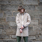 model wears paradaiza parka in sand 