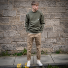 Model wears Para-Daiza khaki crew and pinch chino with converse 