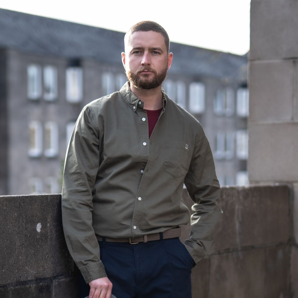 Model wears Para-Daiza button down khaki shirt