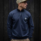 model wears paradaiza 1/4 zip navy sweat and cap