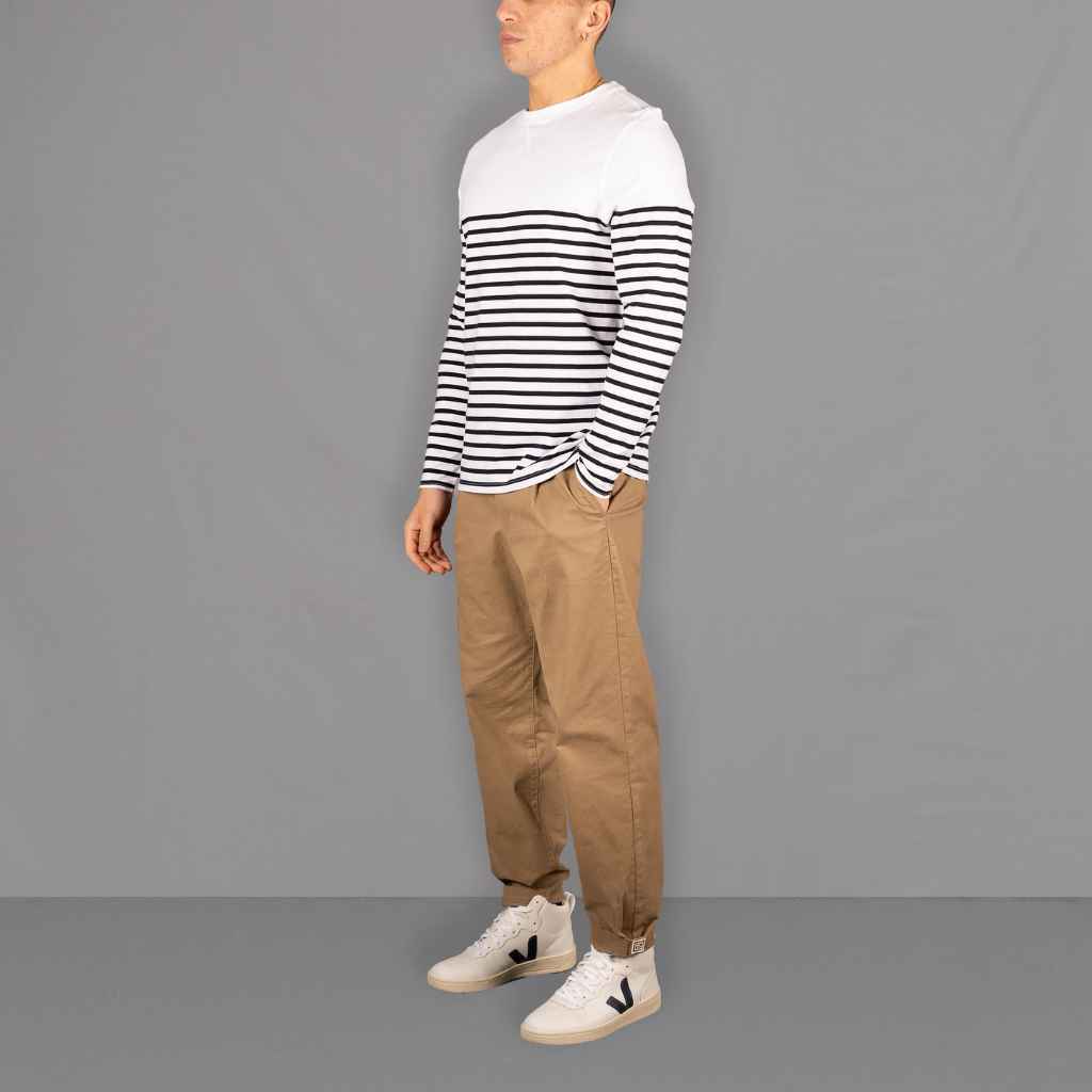 model wears paradaiza white and navy stripe  top with pinch chino 