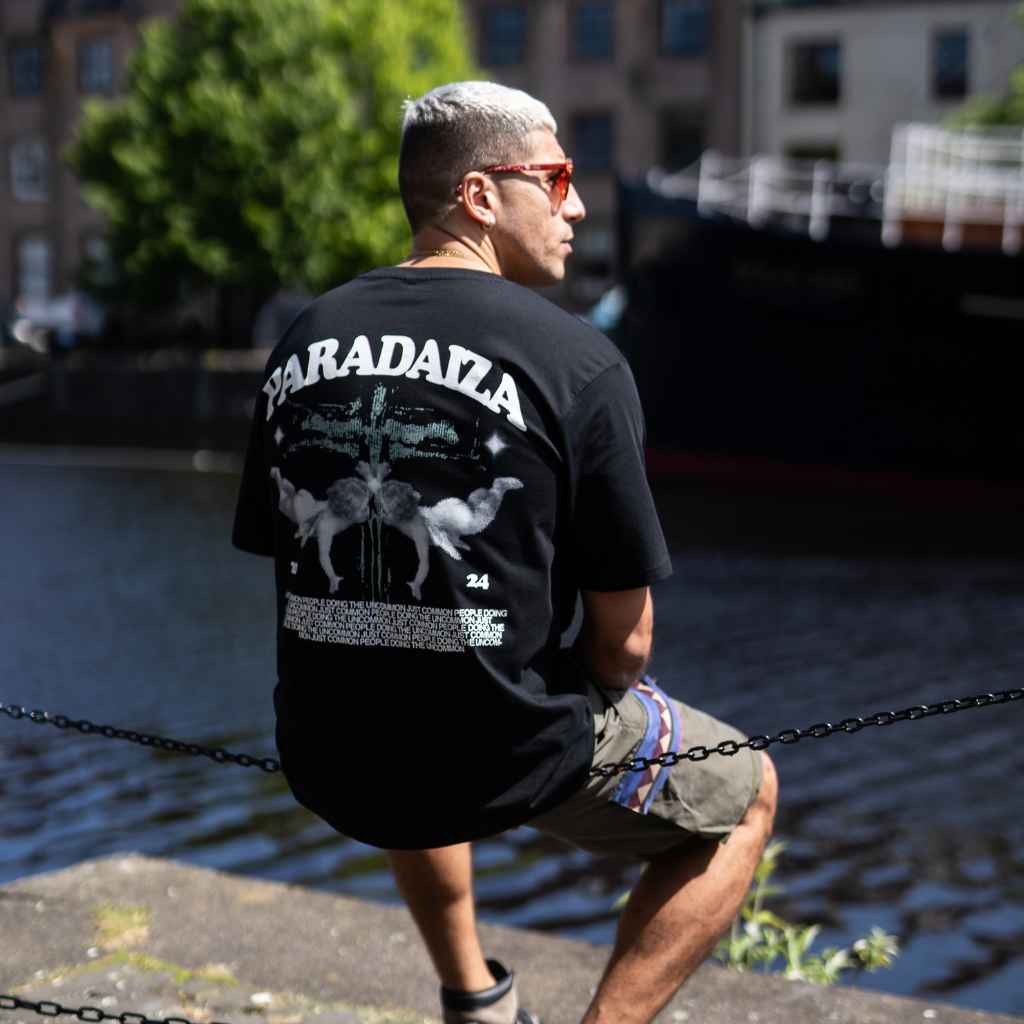 model wears paradaiza twin cherub tee in black