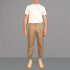 model wears para-daiza tan pinch chinos with converse