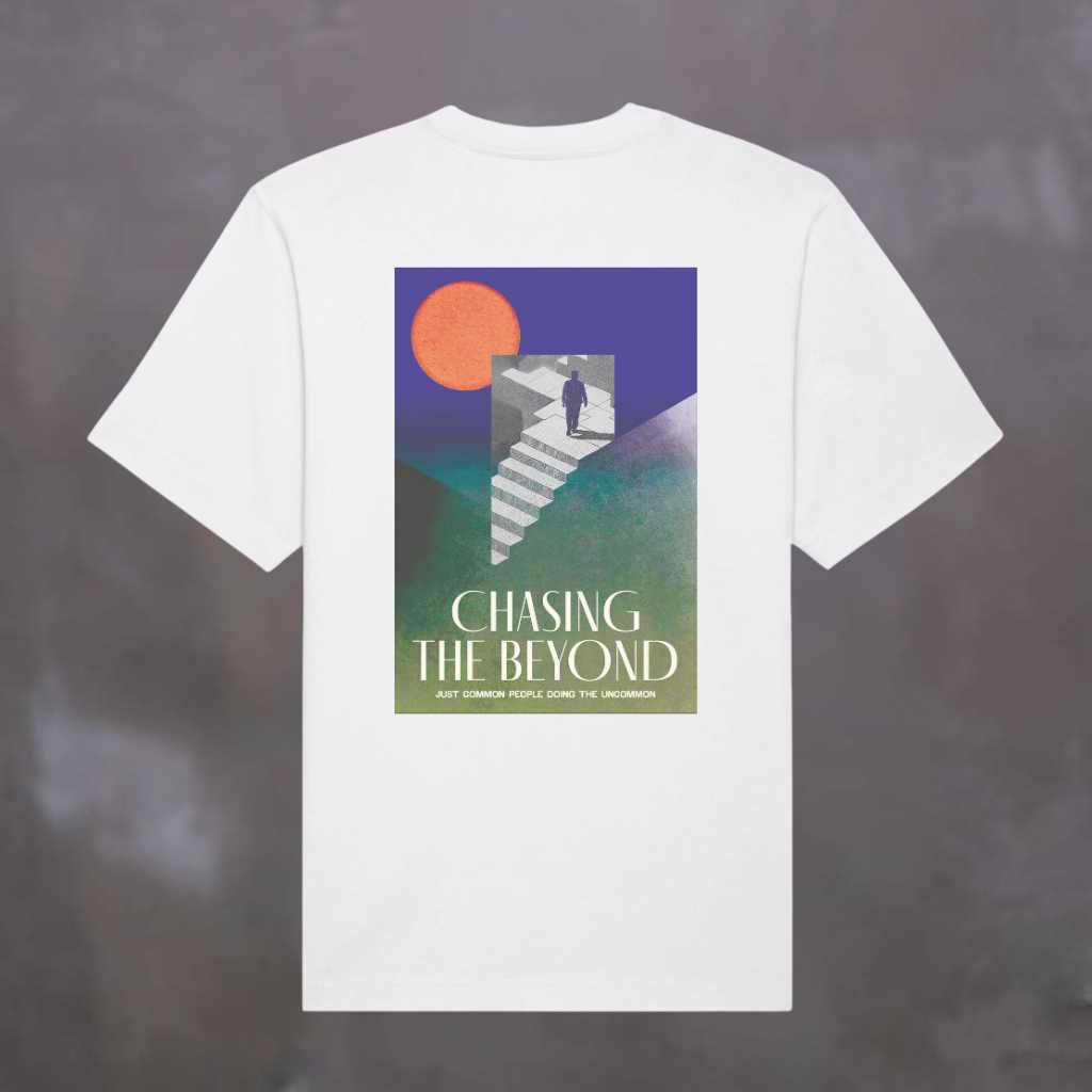 Paradaiza White t-shirt with 'Chasing the Beyond' graphic design on a dark background