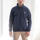 model wears paradaiza 1/4 zip navy sweat