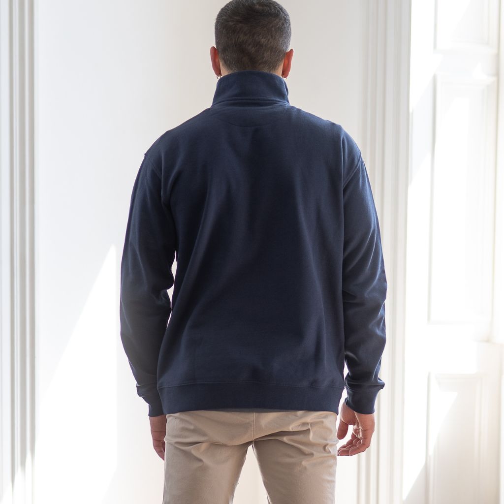 model wears paradaiza 1/4 zip navy sweat