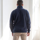 model wears paradaiza 1/4 zip navy sweat