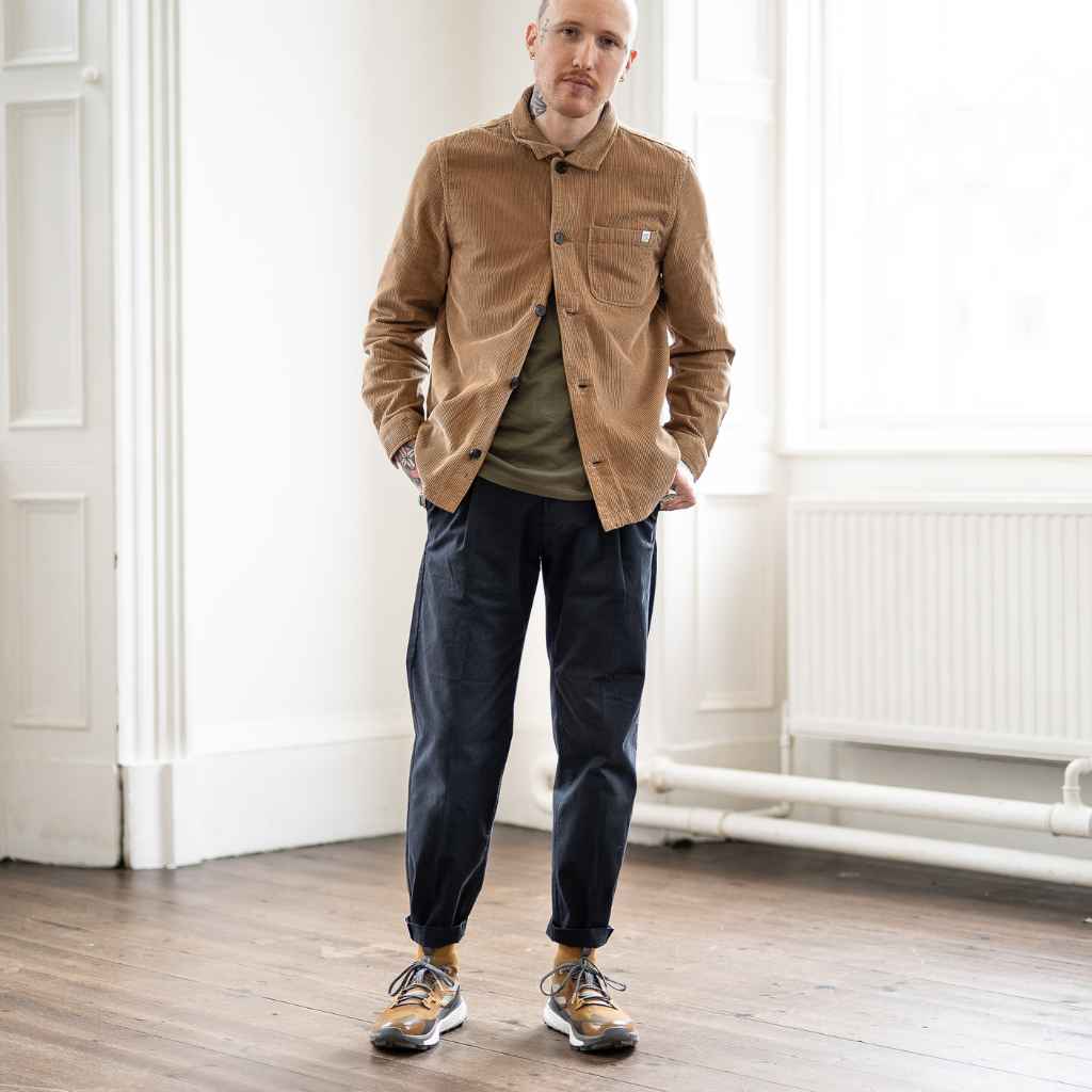 model wears paradaiza cord overshirt with navy pinch chino