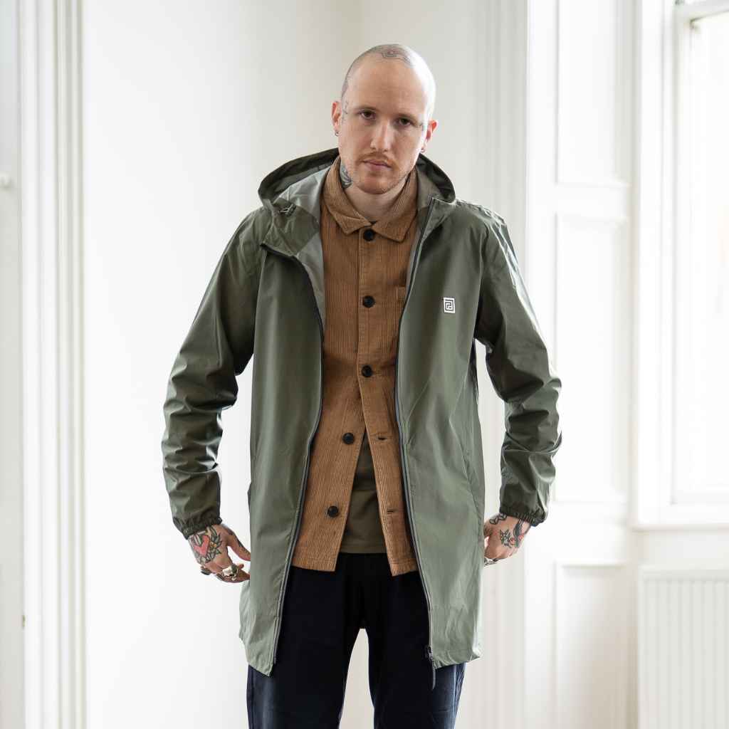 model wears paradaiza parka and cord overshirt