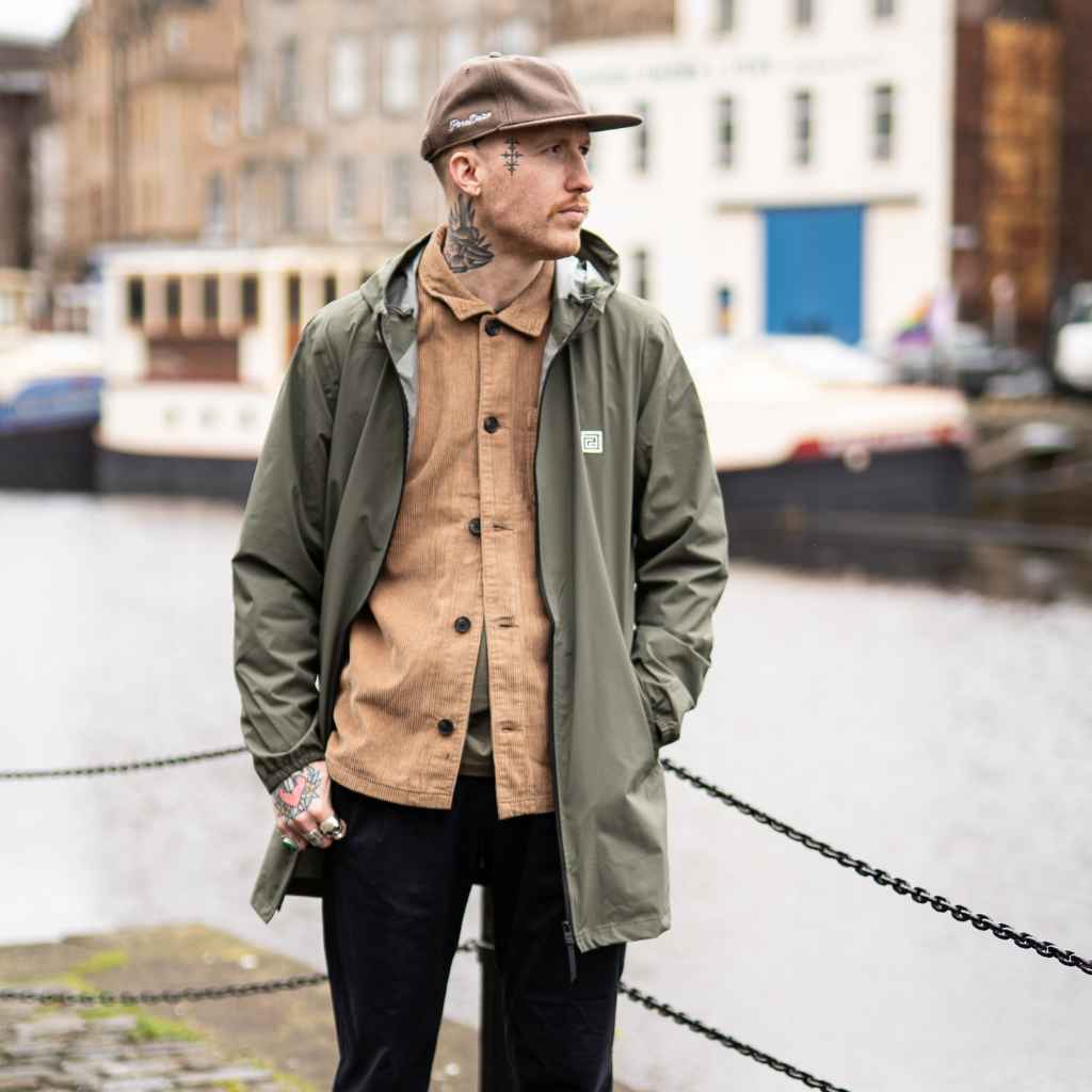 model wears paradaiza parka and cord overshirt