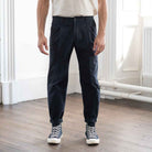 model wears paradaiza pinch tapered chinos  with com des garcon coverse