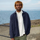 A man wearing a Paradaiza navy-colored worker jacket with long sleeves