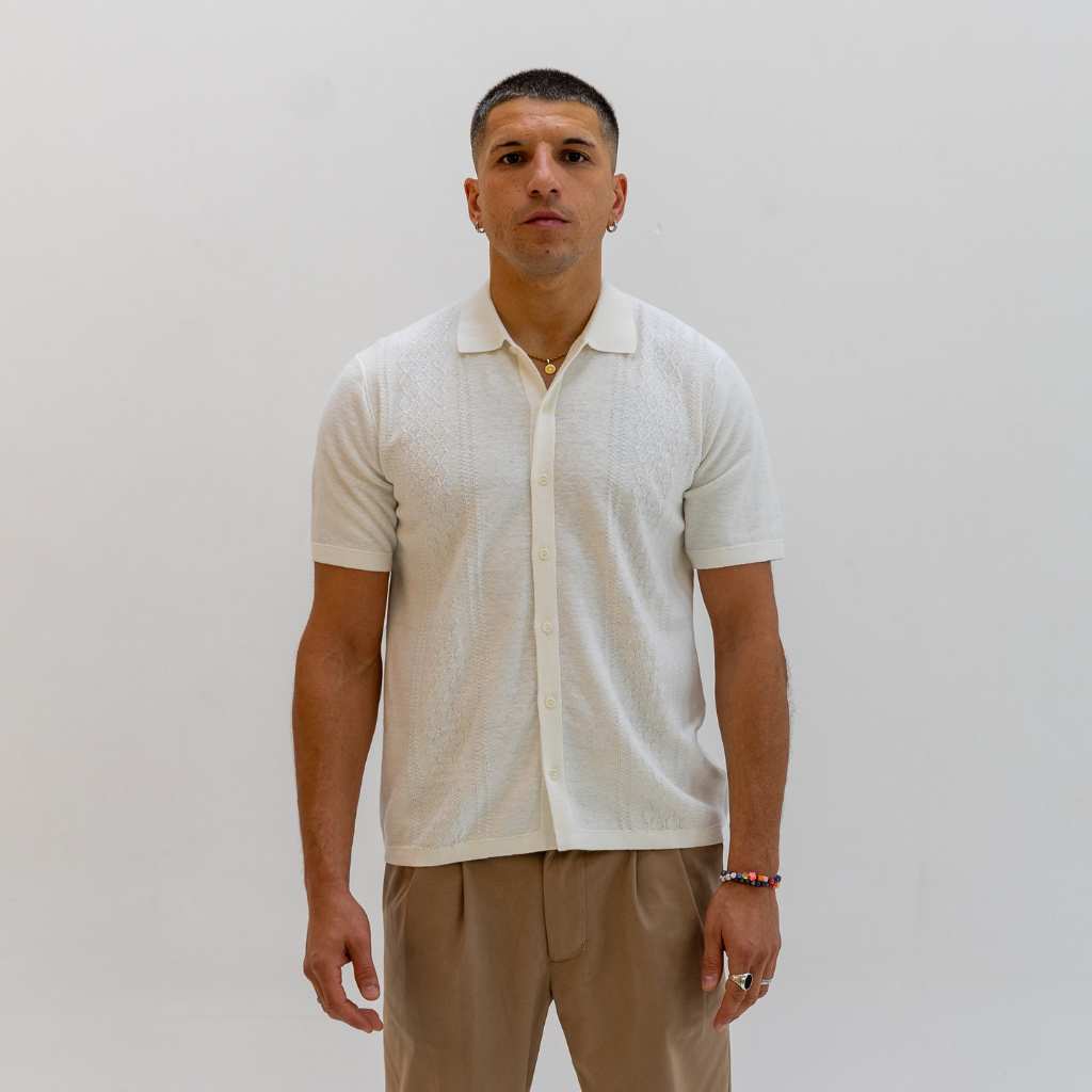 model wears a  Paradaiza Ivory  short-sleeve knitted polo shirt