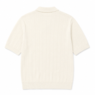 An Paradaiza off-white short-sleeve knit polo shirt with vertical ribbed texture, shown from the back on a clean white background.