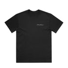 Black t-shirt with a small white logo on a light gray background