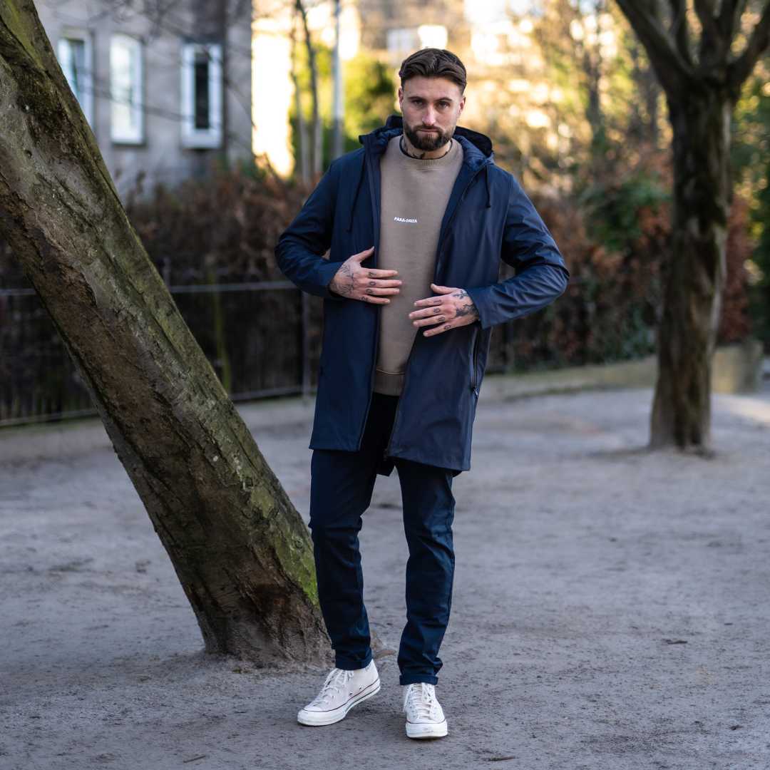 Model wears Para-Daiza Navy superflex chino, parka and converse.