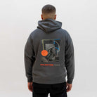 Person wearing a grey paradaiza  hoodie with a graphic design on the back against a white background