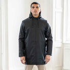 model wears fully waterproof black para-daiza parka jacket