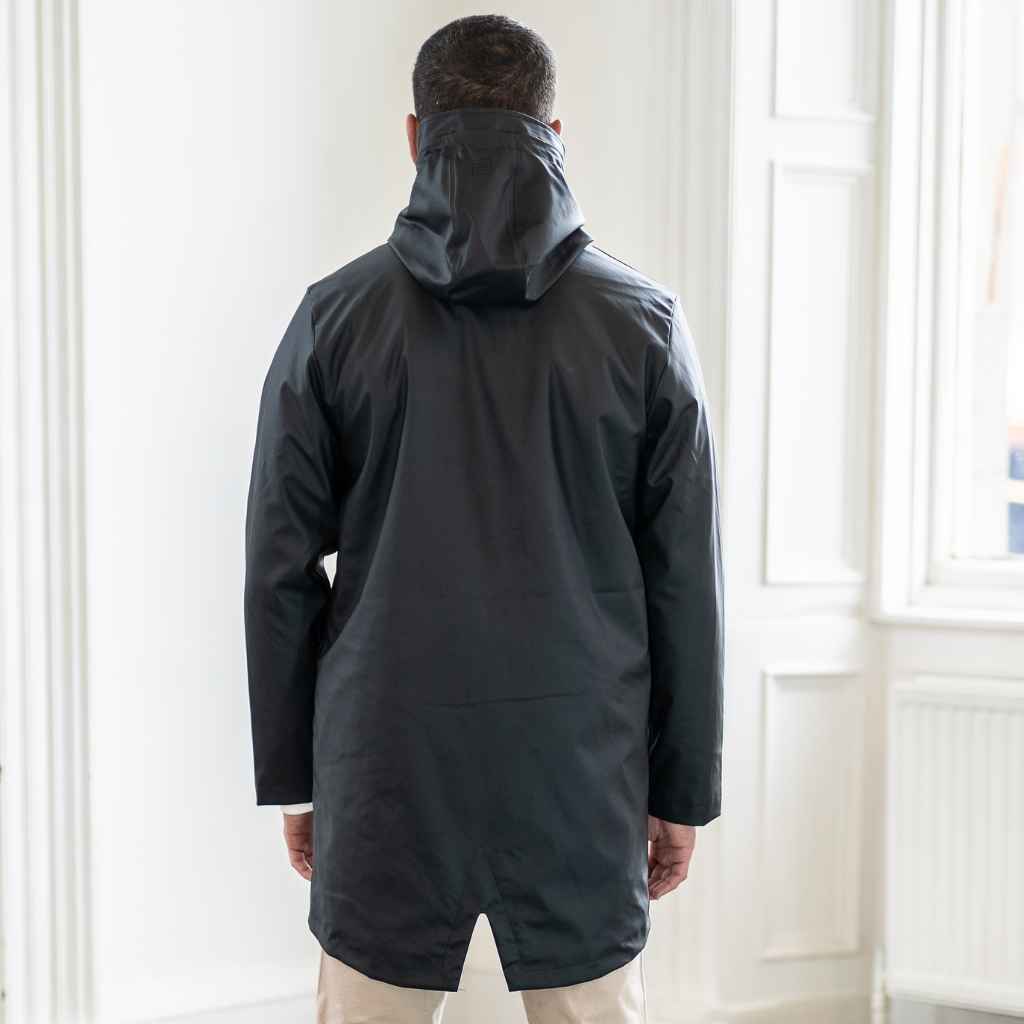 model wears fully waterproof black para-daiza parka jacket