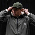 model wears paradaiza core five panel khaki cap