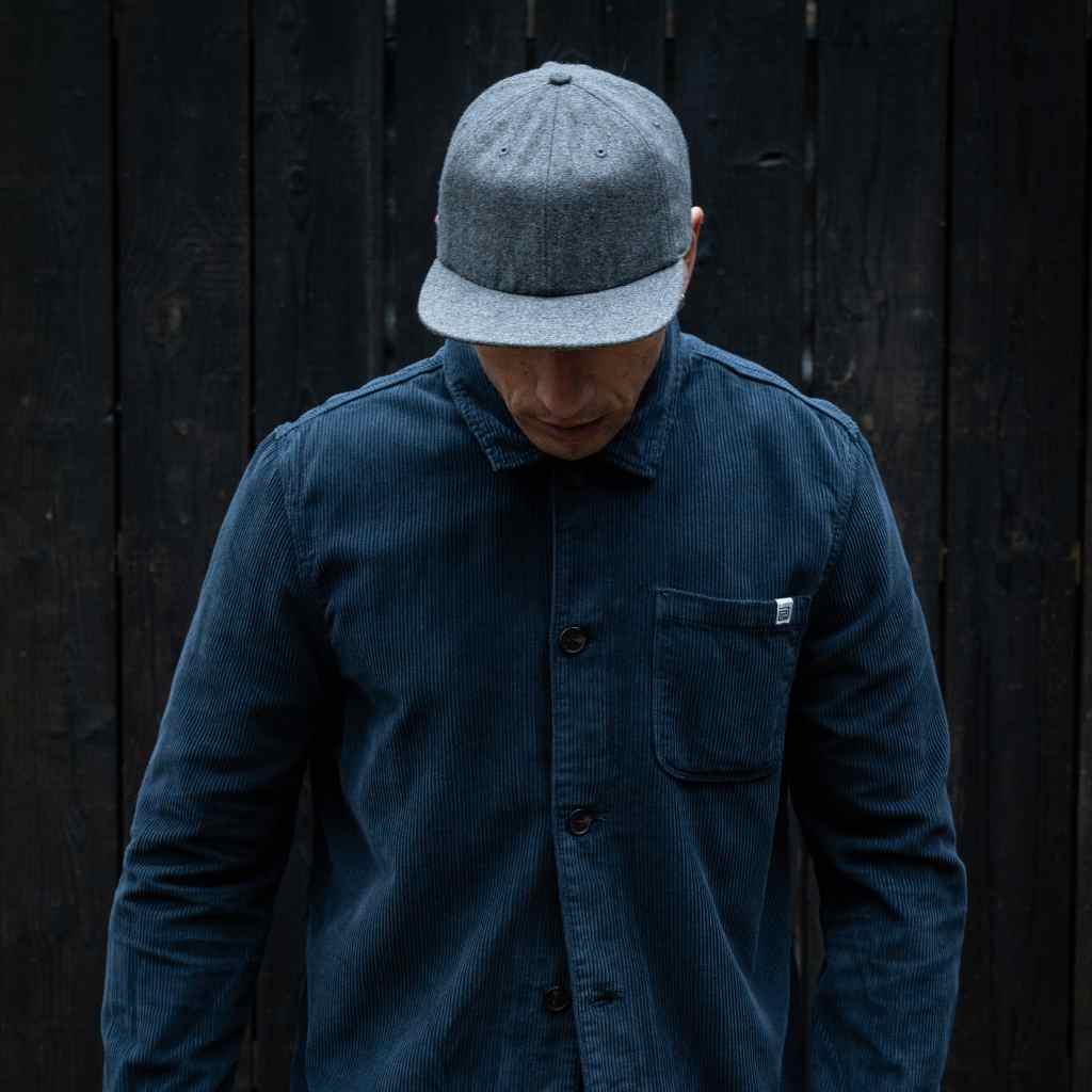 model wears paradaiza classic grey cap with cord overshirt 