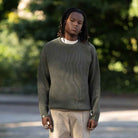 model wears paradaiza fisherman knit in khaki