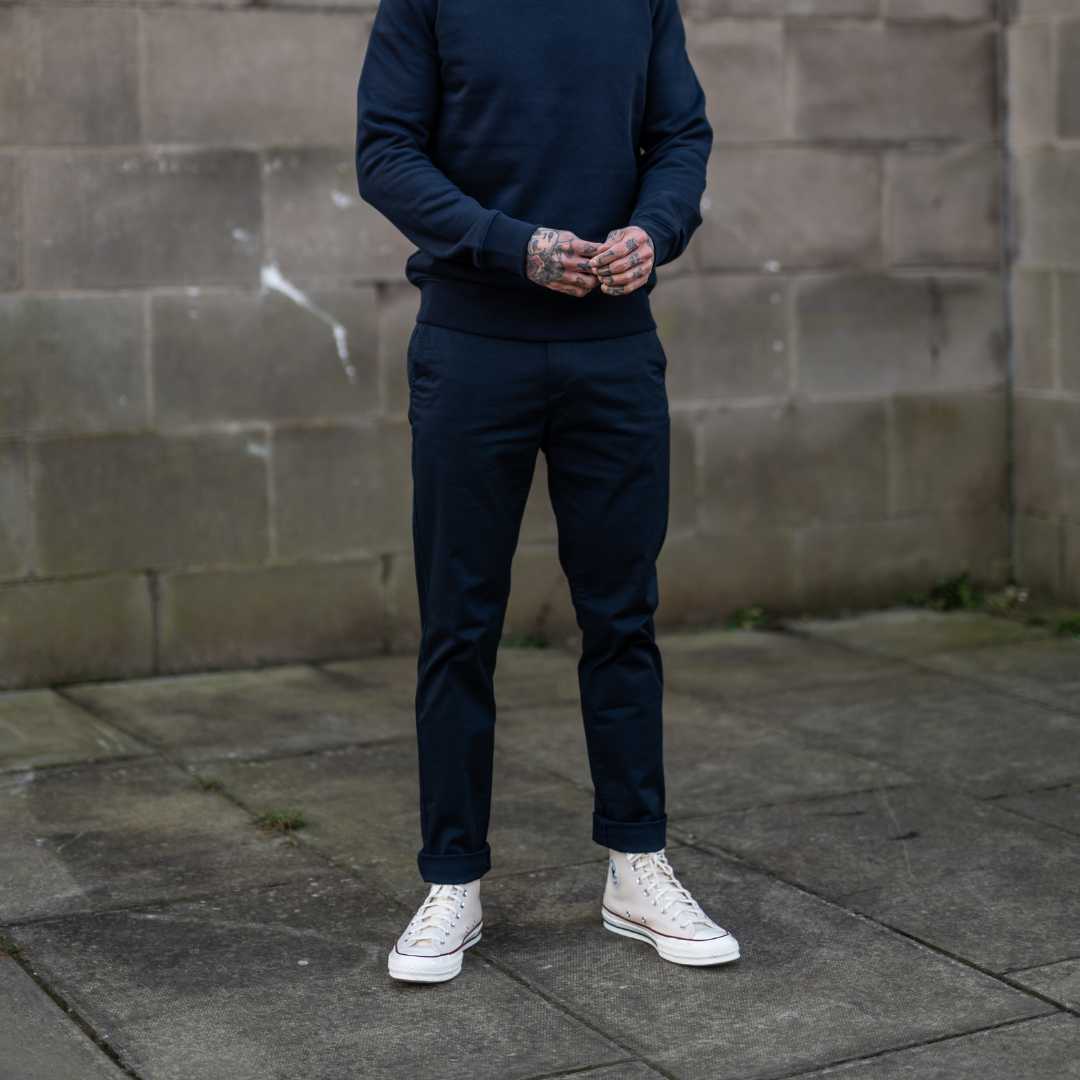 Model wears Para-Daiza Navy superflex chino, crewsweatshirt , and converse.