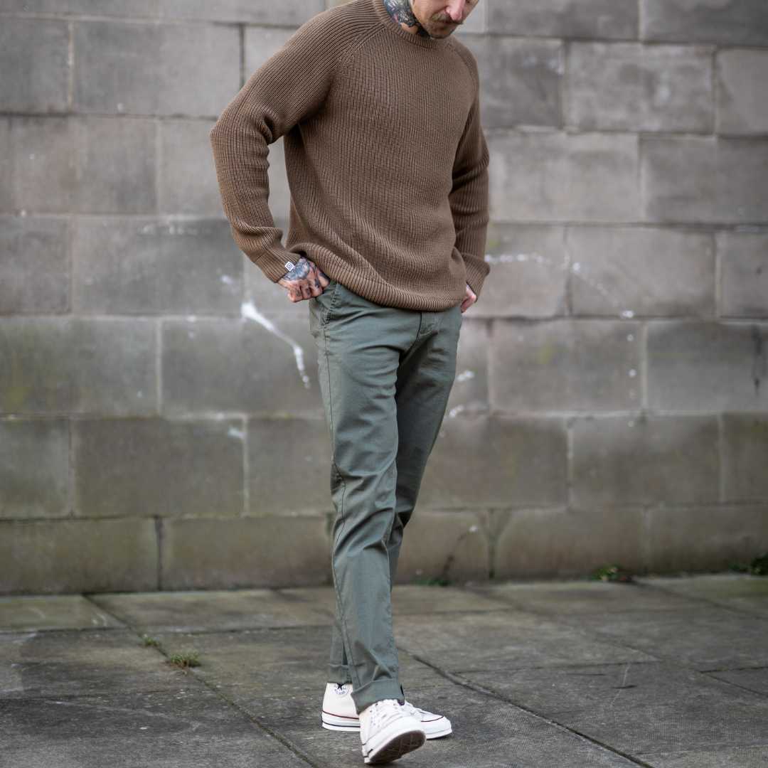 model wears para-daiza knit with core chinos and  converse