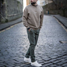 Model wears Para-Daiza Oversized Tan Crew neck sweatshirt superflex chino with converse