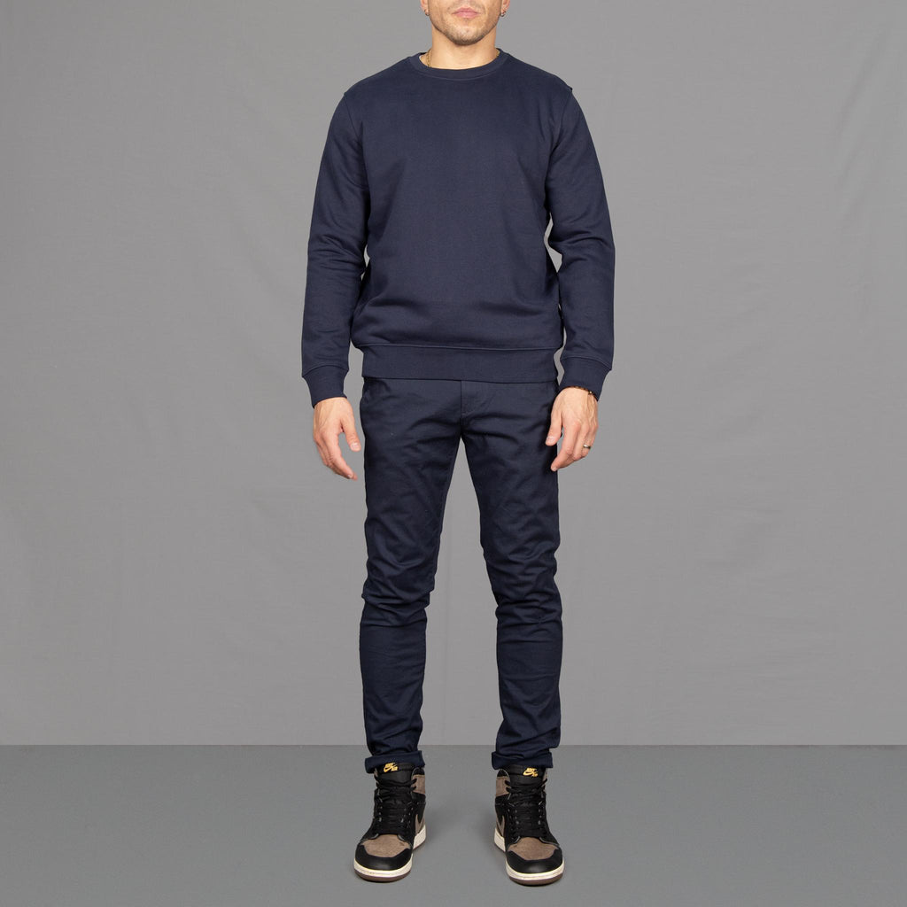 Model wears Para-Daiza Navy Crew neck sweatshirt  superflex chino  and Nike trainers. 