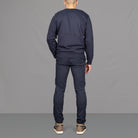 Model wears Para-Daiza Navy Crew neck sweatshirt  superflex chino and Nike trainers. 