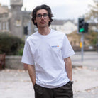 Paradaiza White t-shirt with 'Chasing the Beyond' graphic design on a model