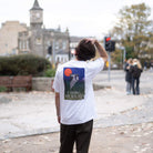 Paradaiza White t-shirt with a graphic design on model