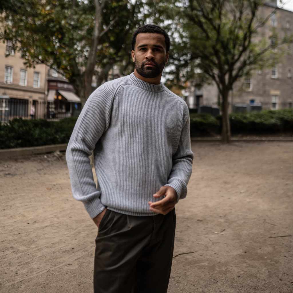 Model wearing a light grey paradaiza cashmere paradaiza knit and chinos 