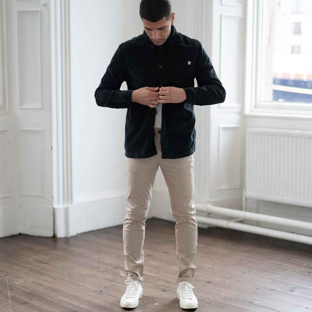 model wears paradaiza cord overshirt , with sand  chinos