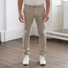 model wears paradaiza core chino in sand 