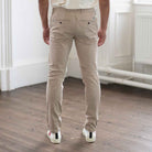 model wears paradaiza core chino in sand 