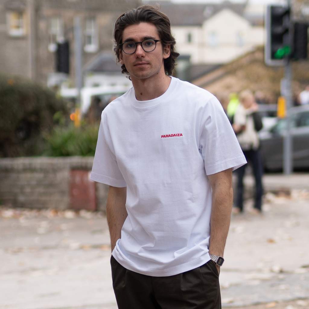 Paradaiza White t-shirt with a graphic design on the back on a model